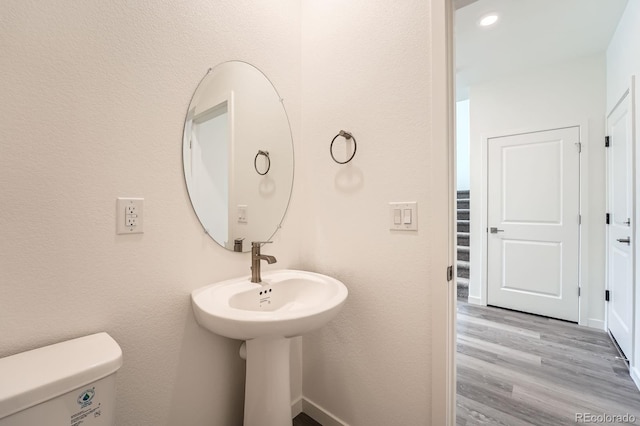 1290 S Algonquian St, Aurora, CO 80018 - half bath with toilet and wood finished floors