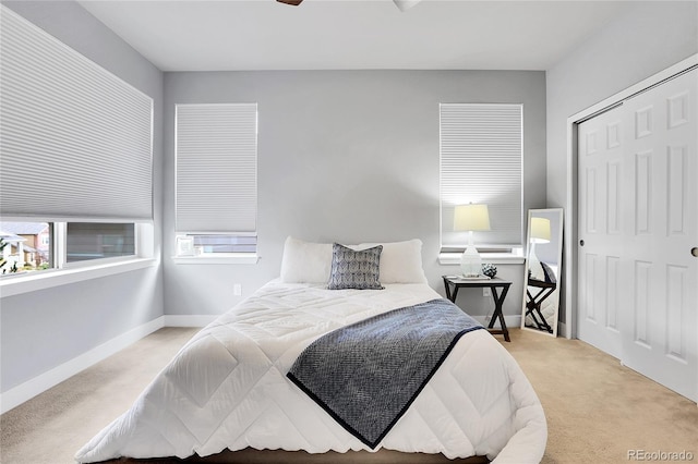 bedroom featuring light colored carpet