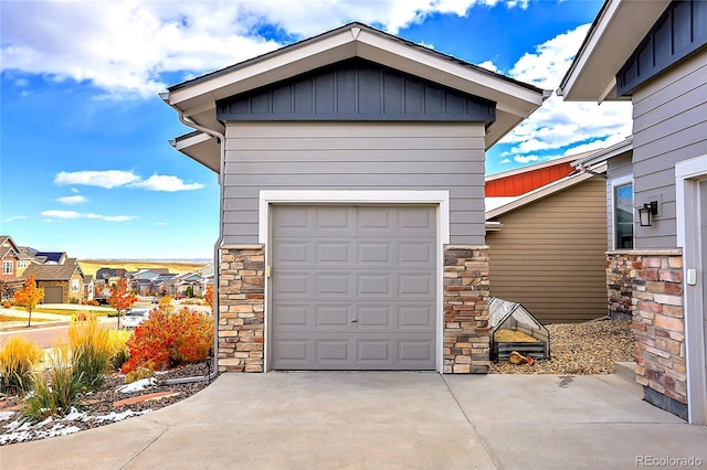 garage featuring concrete driveway