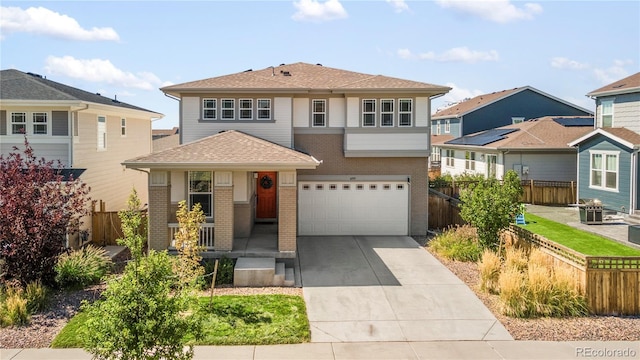 6099 N Netherland Ct, Aurora, CO 80019 - view of front of home with brick siding, driveway, a shingled roof, an attached garage, and a residential view