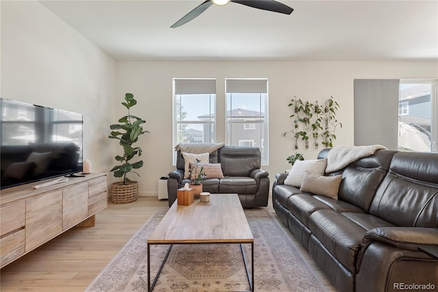 6099 N Netherland Ct, Aurora, CO 80019 - living area featuring light wood-style floors, ceiling fan, and baseboards