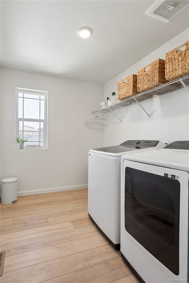 6099 N Netherland Ct, Aurora, CO 80019 - laundry area featuring separate washer and dryer, light wood finished floors, baseboards, and recessed lighting