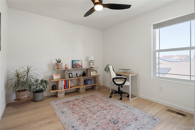 6099 N Netherland Ct, Aurora, CO 80019 - office area with wood finished floors, a ceiling fan, and baseboards