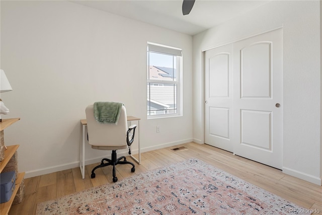 6099 N Netherland Ct, Aurora, CO 80019 - unfurnished office featuring wood finished floors, a ceiling fan, and baseboards