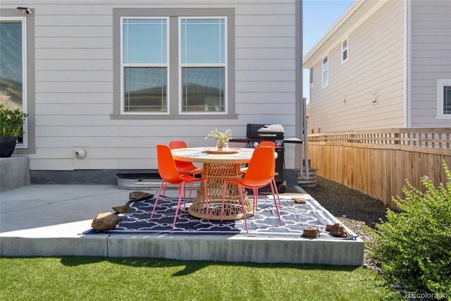 6099 N Netherland Ct, Aurora, CO 80019 - view of patio / terrace featuring area for grilling and outdoor dining space