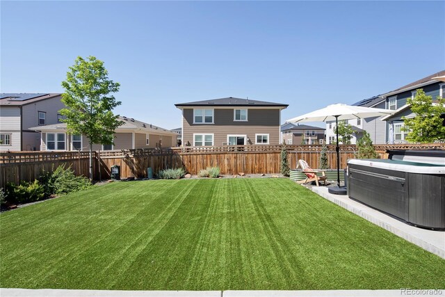 6099 N Netherland Ct, Aurora, CO 80019 - view of yard with a residential view, a hot tub, and central AC unit