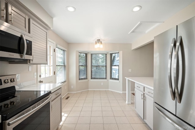 18 Brixham Ct, Castle Pines, CO 80108 - kitchen featuring stainless steel appliances, light countertops, recessed lighting, baseboards, and light tile patterned floors