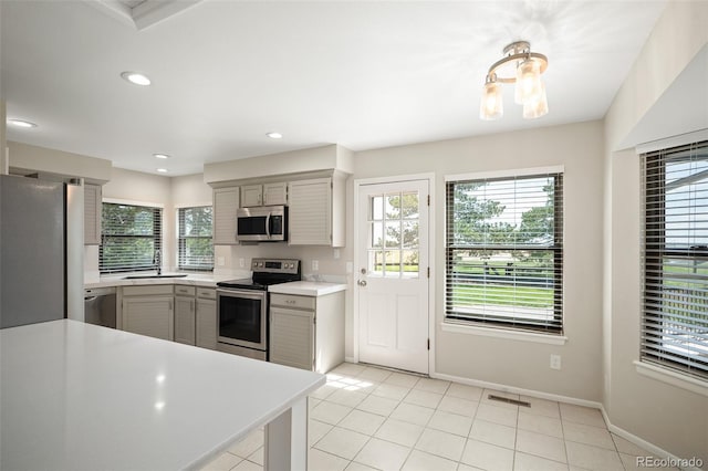 18 Brixham Ct, Castle Pines, CO 80108 - kitchen featuring stainless steel appliances, gray cabinetry, a sink, plenty of natural light, and recessed lighting