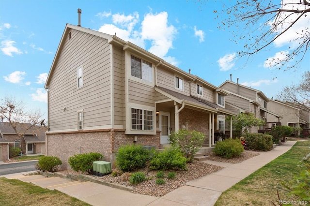 exterior space featuring brick siding