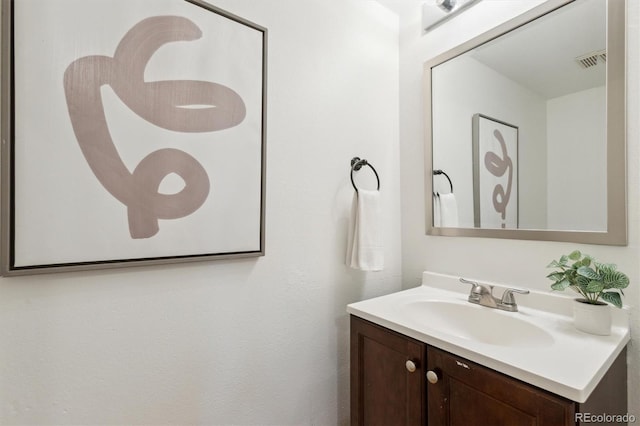 bathroom featuring vanity and visible vents