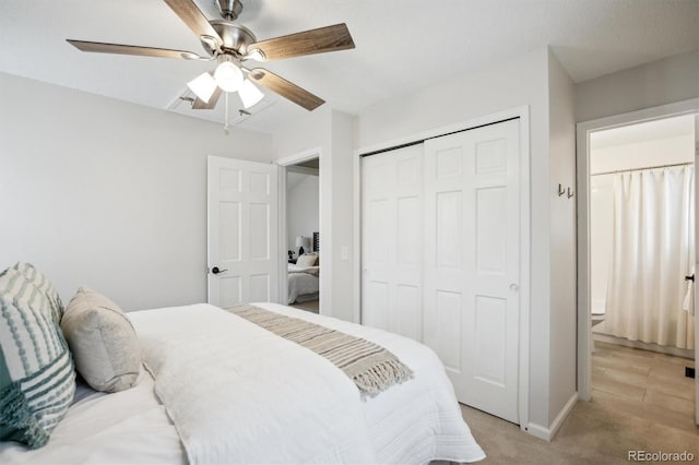bedroom featuring baseboards, ceiling fan, light carpet, and a closet