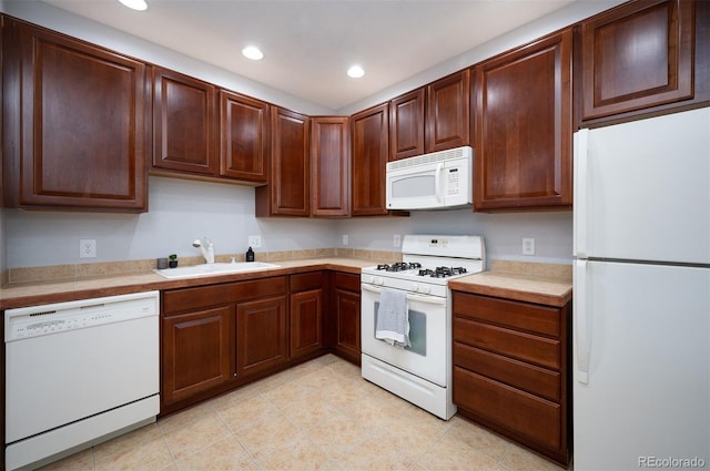 kitchen with sink and white appliances