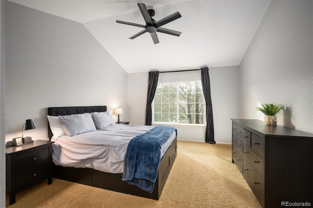 carpeted bedroom featuring ceiling fan and vaulted ceiling