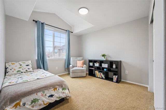 carpeted bedroom with vaulted ceiling