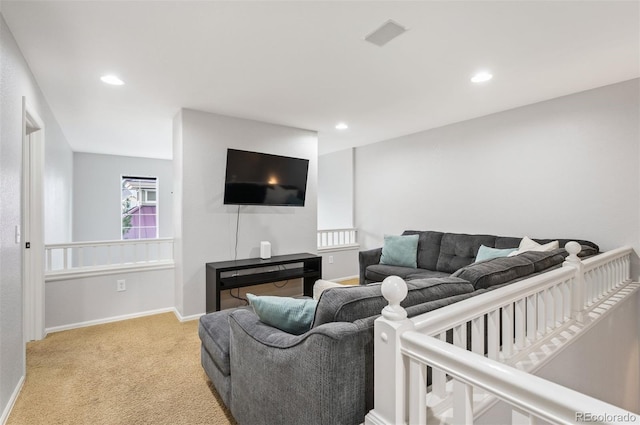 living room featuring light carpet