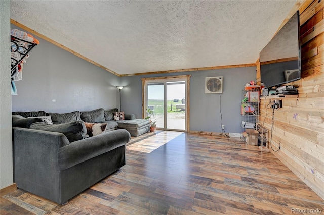 5525 S Johnson Rd, Rush, CO 80833 - living area featuring a textured ceiling, wood finished floors, and wooden walls