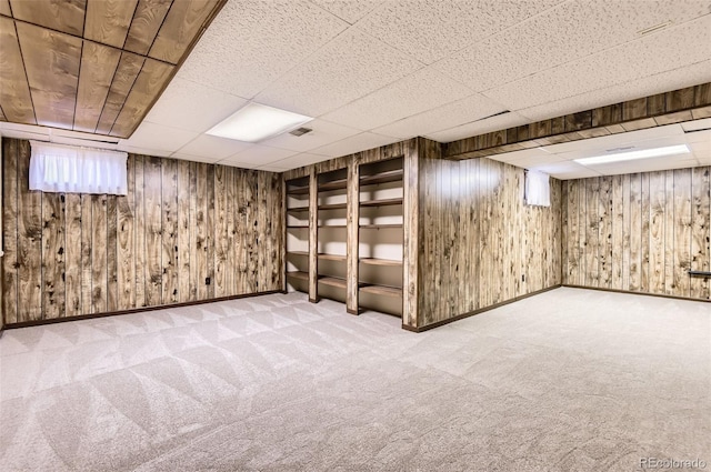 13940 E Linvale Pl, Aurora, CO 80014 - finished basement with carpet floors, a drop ceiling, baseboards, and wood walls