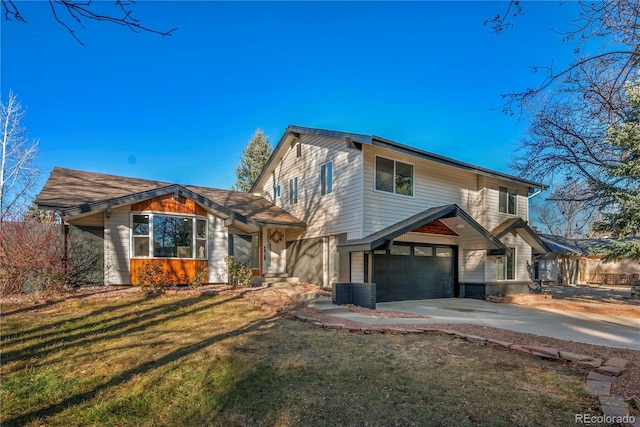 view of front facade with a front yard and a garage