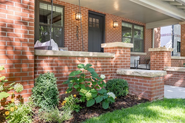 doorway to property featuring covered porch