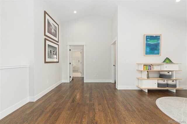 living room with dark hardwood / wood-style floors and high vaulted ceiling