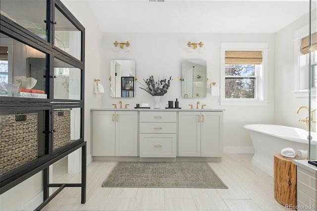 bathroom with vanity and a bathing tub