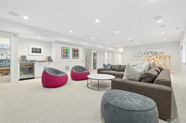 living room with bar, light carpet, and wine cooler