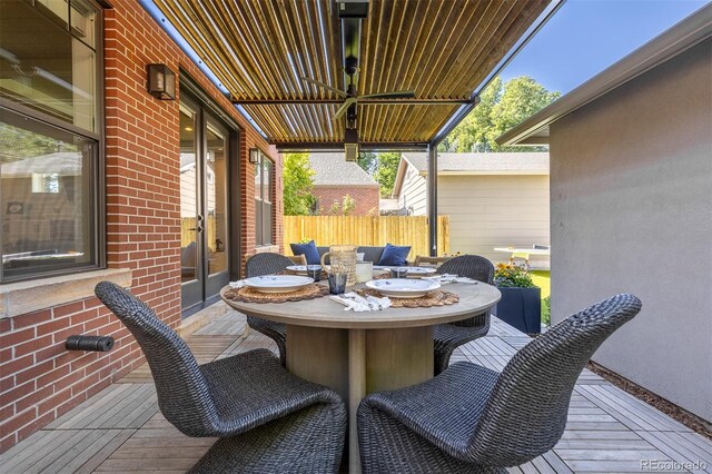 view of patio with ceiling fan and a deck