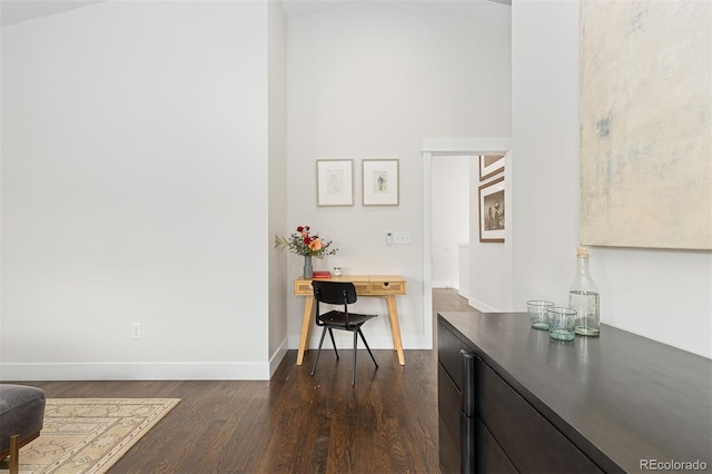 interior space featuring dark hardwood / wood-style floors and dark brown cabinets