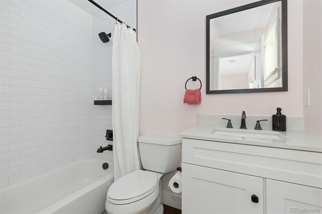 full bathroom featuring vanity, toilet, and shower / tub combo