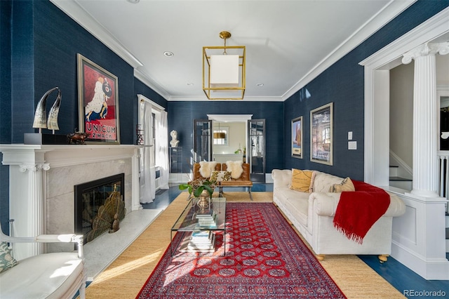 living room with a fireplace, crown molding, and hardwood / wood-style floors