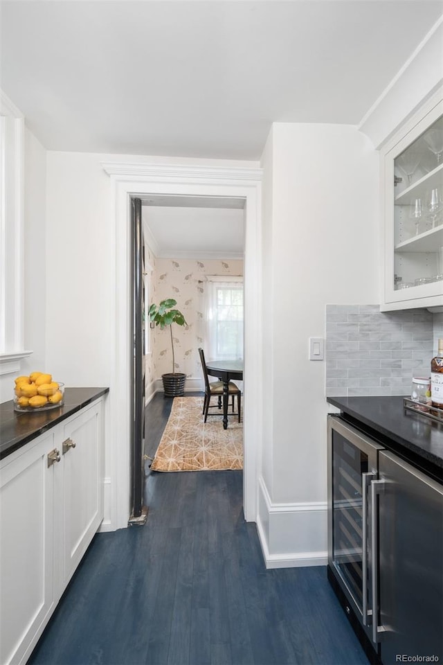 kitchen featuring white cabinets, wine cooler, tasteful backsplash, and dark hardwood / wood-style flooring