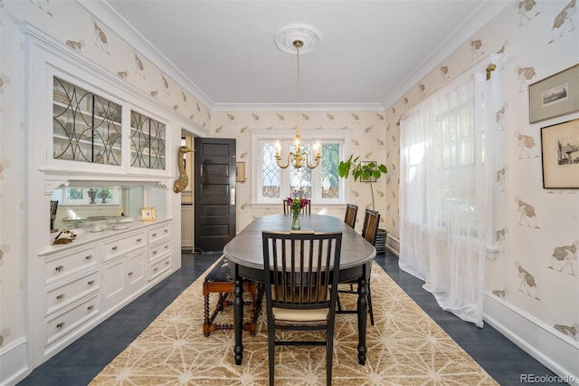 dining area featuring ornamental molding, dark hardwood / wood-style flooring, and a chandelier