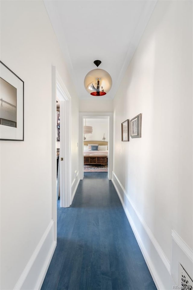 hall with dark hardwood / wood-style flooring