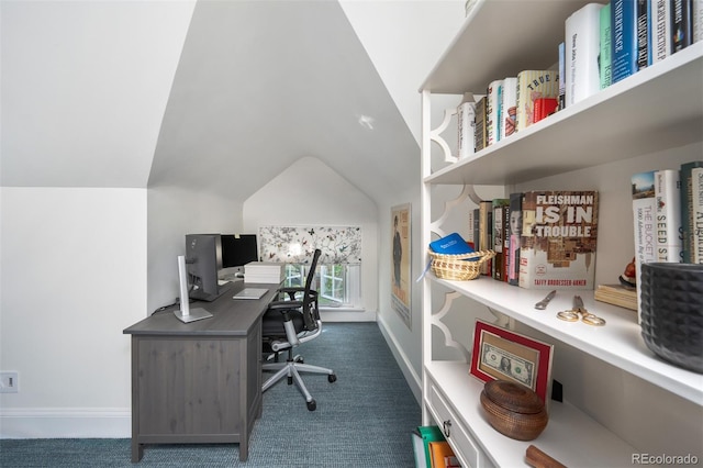 carpeted home office featuring vaulted ceiling