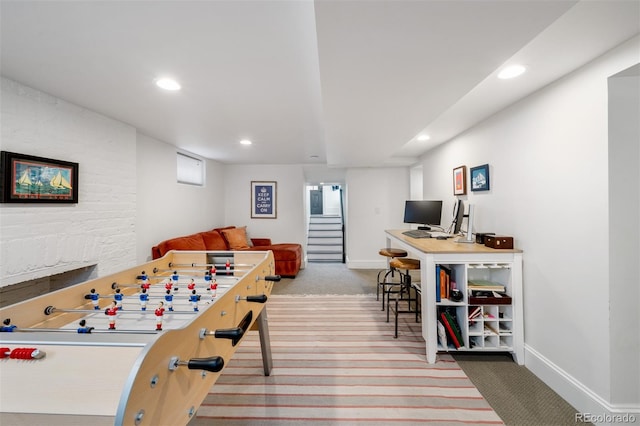 recreation room with a wealth of natural light and carpet flooring