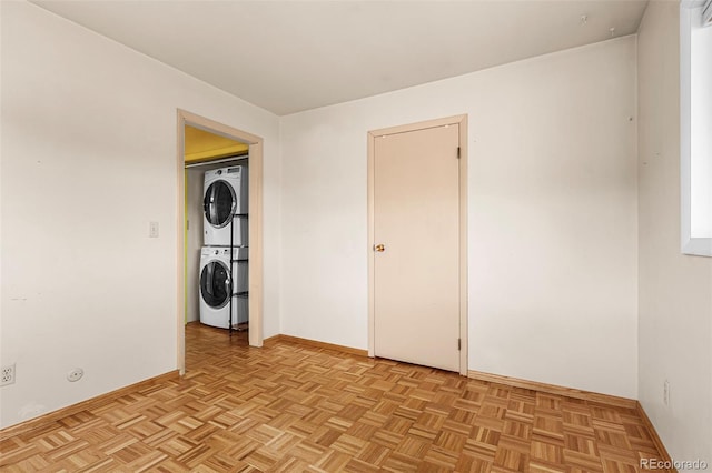301 Lagoon Ln, Silverthorne, CO 80498 - unfurnished room with stacked washing machine and dryer and baseboards