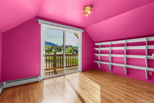 301 Lagoon Ln, Silverthorne, CO 80498 - bonus room with lofted ceiling, wood finished floors, and baseboard heating