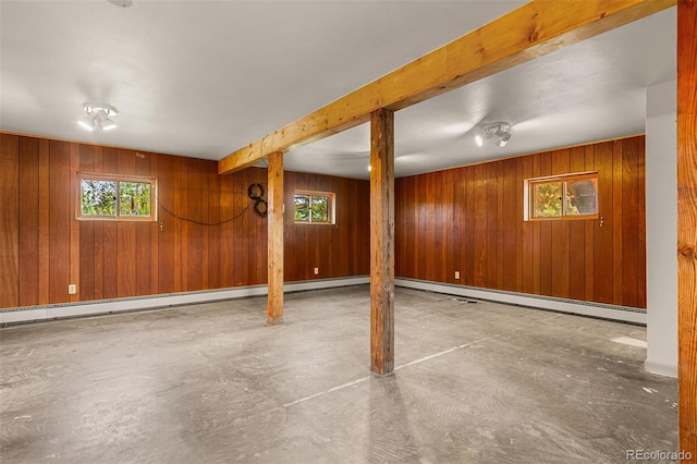 301 Lagoon Ln, Silverthorne, CO 80498 - basement featuring plenty of natural light, wood walls, and a baseboard heating unit