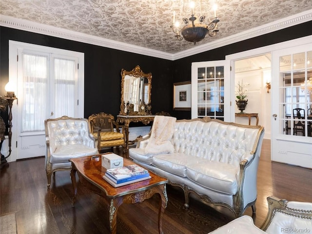 living room with ornamental molding, dark hardwood / wood-style flooring, and a chandelier