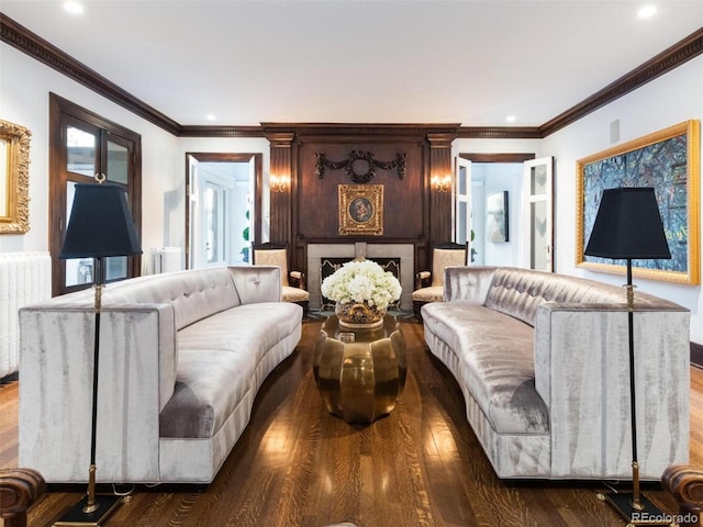 living room featuring ornamental molding, dark hardwood / wood-style flooring, and radiator