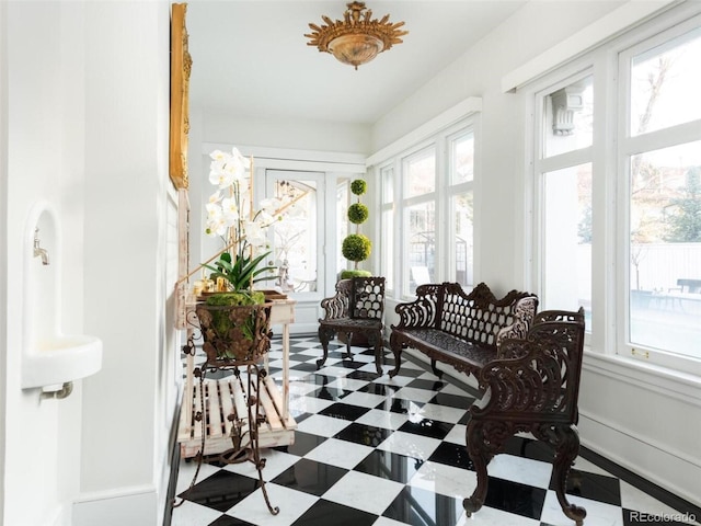 sunroom / solarium featuring a healthy amount of sunlight