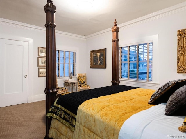 bedroom featuring ornamental molding and carpet floors