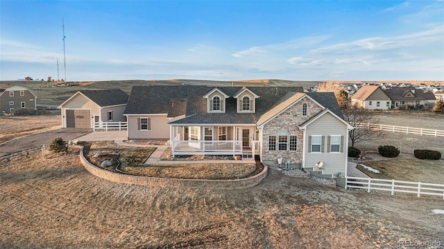 view of front of home with covered porch and a garage