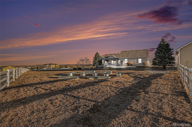 view of yard at dusk