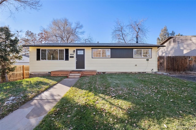 ranch-style house with a front yard