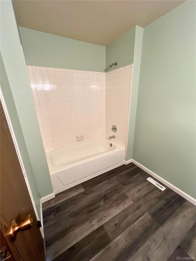 3415 S Ammons St Unit 24-2, Lakewood, CO 80227 - full bathroom with wood finished floors,  shower combination, and baseboards