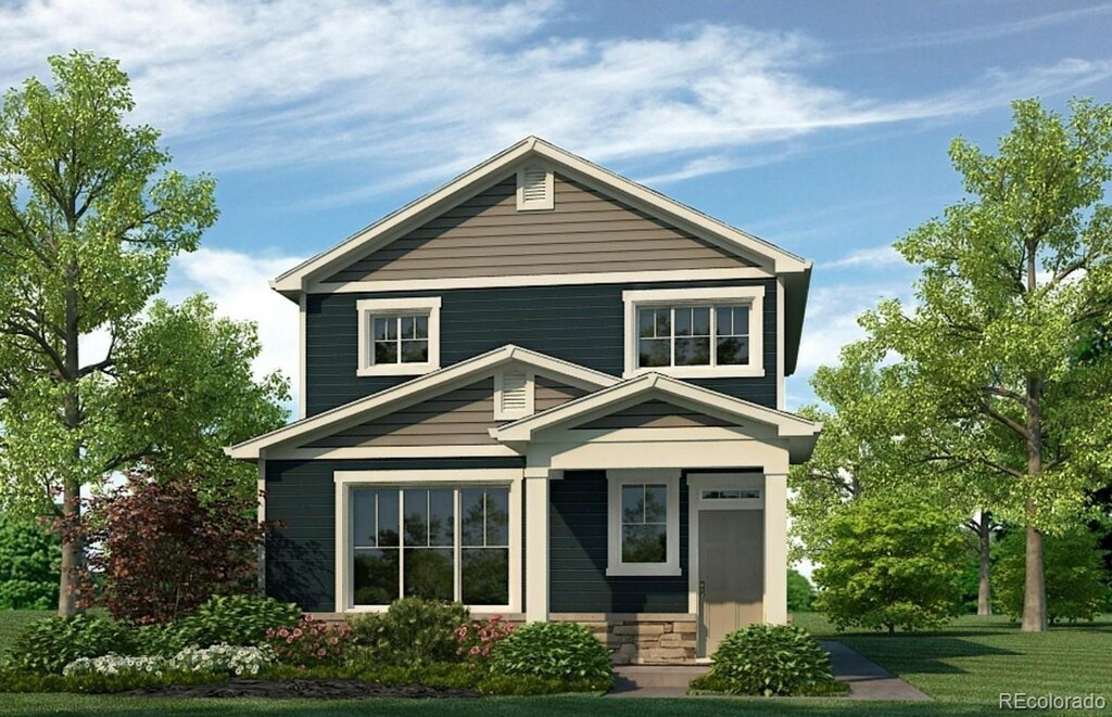 673 N Tempe St, Aurora, CO 80018 - view of front of house with stone siding and a front lawn