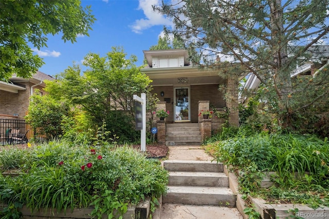 3024 W Denver Pl, Denver, CO 80211 - view of front of house with a porch and brick siding