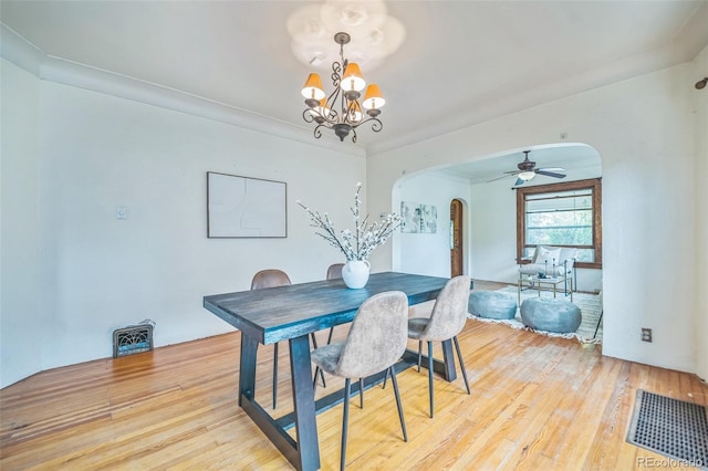3024 W Denver Pl, Denver, CO 80211 - dining room with arched walkways, light wood-type flooring, a chandelier, and a ceiling fan