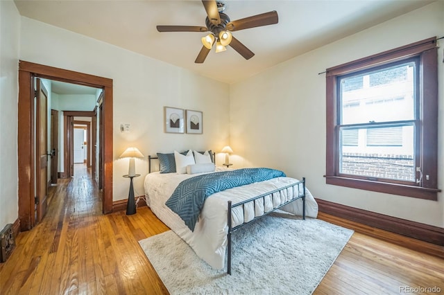 3024 W Denver Pl, Denver, CO 80211 - bedroom featuring wood-type flooring, baseboards, and a ceiling fan
